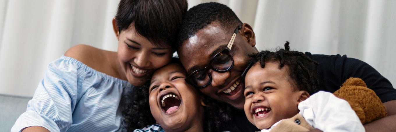 Image of family laughing together