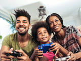 Parents with child playing video games